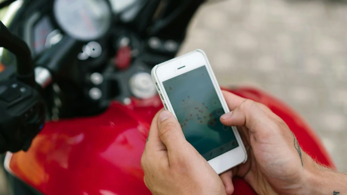 Mobile phone on red motorcycle 