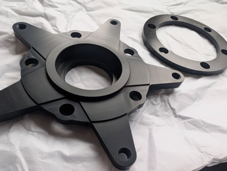 Machined brake disc carrier and spacer ring for PVM 10Y wheelset in a Husqvarna Nuda